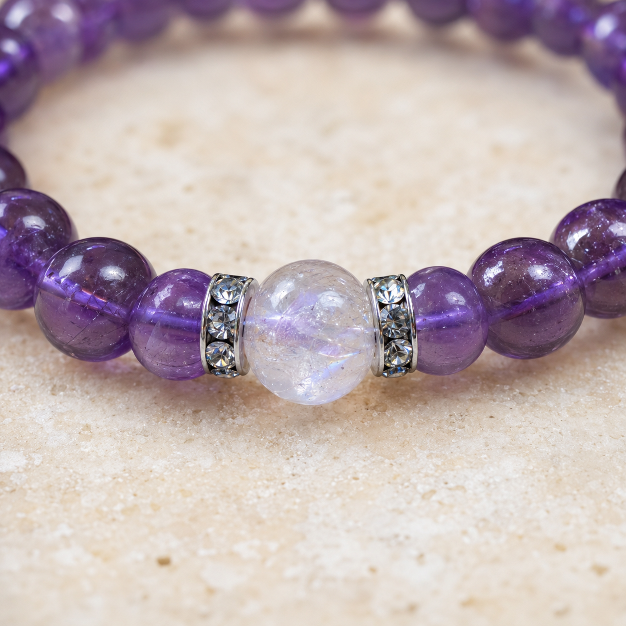Close-up of crackle clear quartz focal bead with zircon spacers
