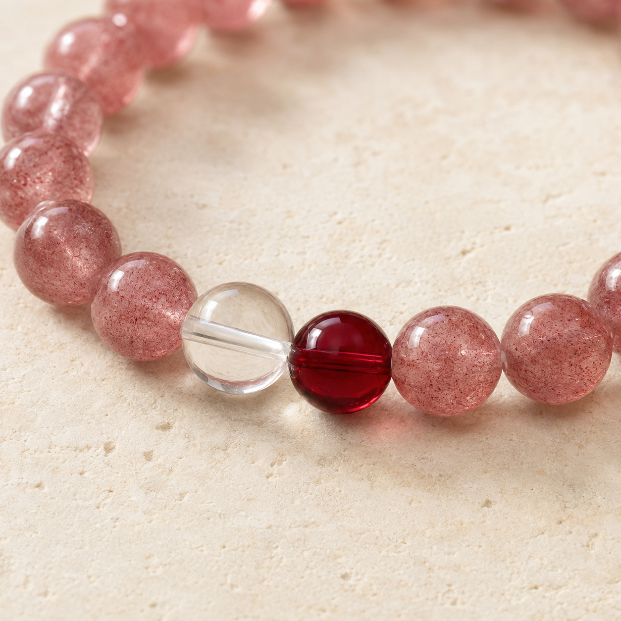 Close-up of clear quartz and garnet accent beads on bracelet