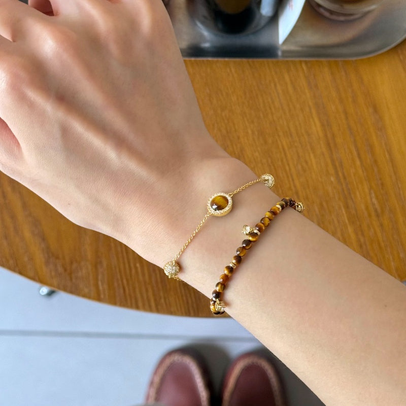 Tiger eye stacking bracelet set on wrist - lifestyle