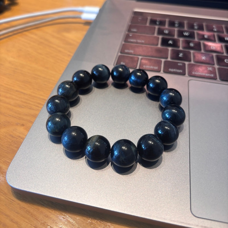 14mm Blue Tiger Eye bracelet on laptop trackpad