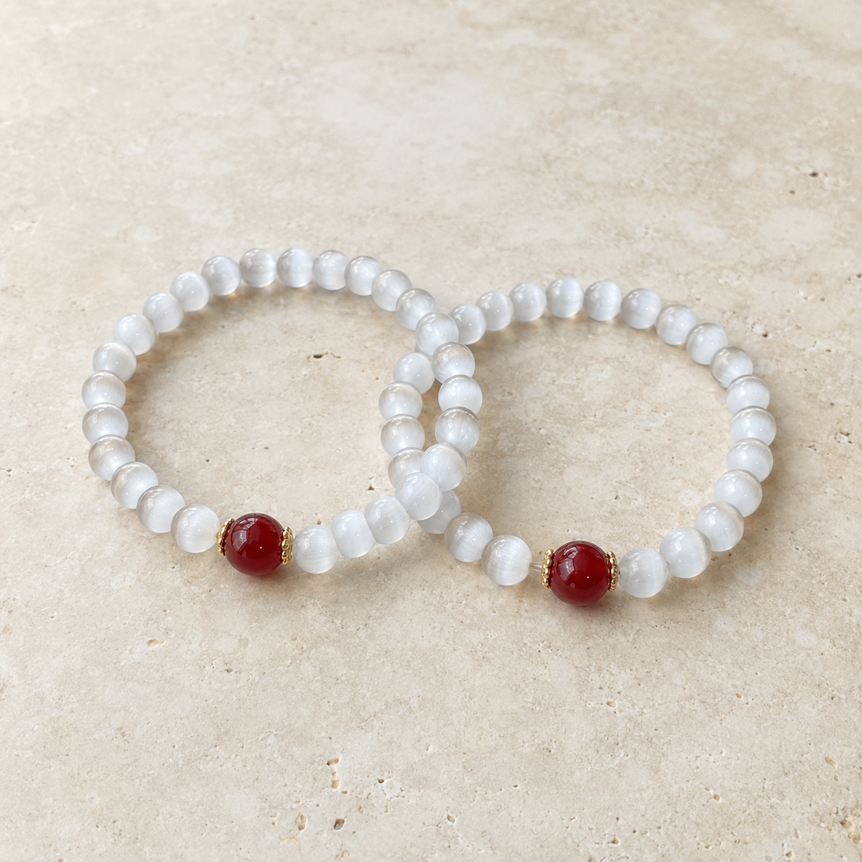 Close-up of red agate focal bead with gold spacers