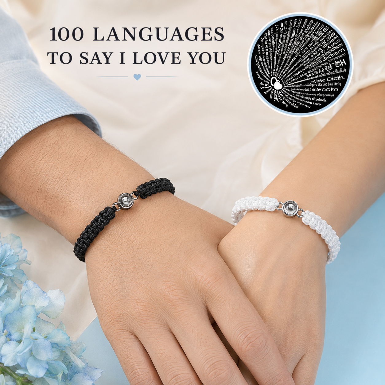 Couple wearing matching black and white I Love You in 100 languages projection bracelets