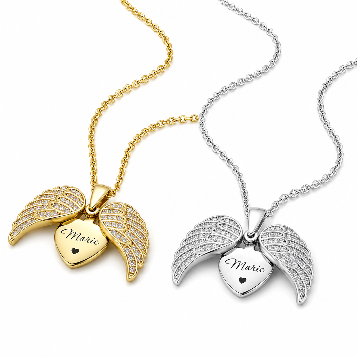 Personalized angel wing necklace in gold and silver tones on stone surface