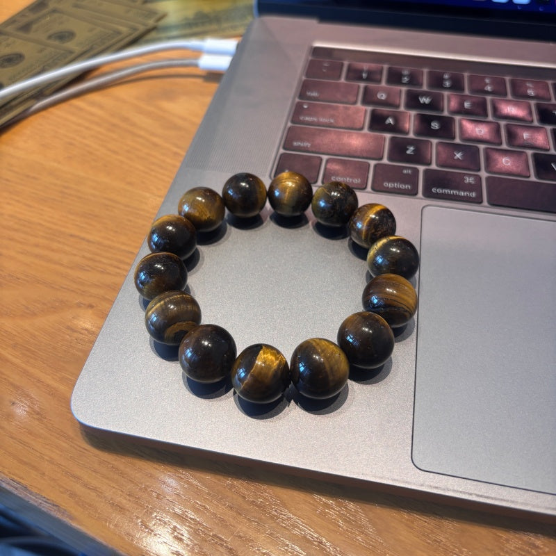 16mm Tiger Eye bracelet on laptop keyboard